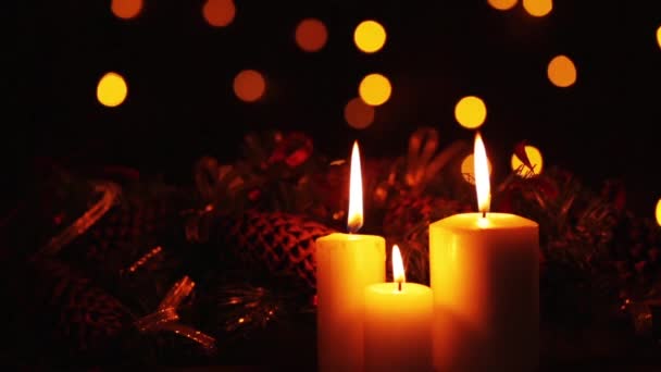 depositphotos_174454922-stock-video-burning-candles-dark-background-christmas